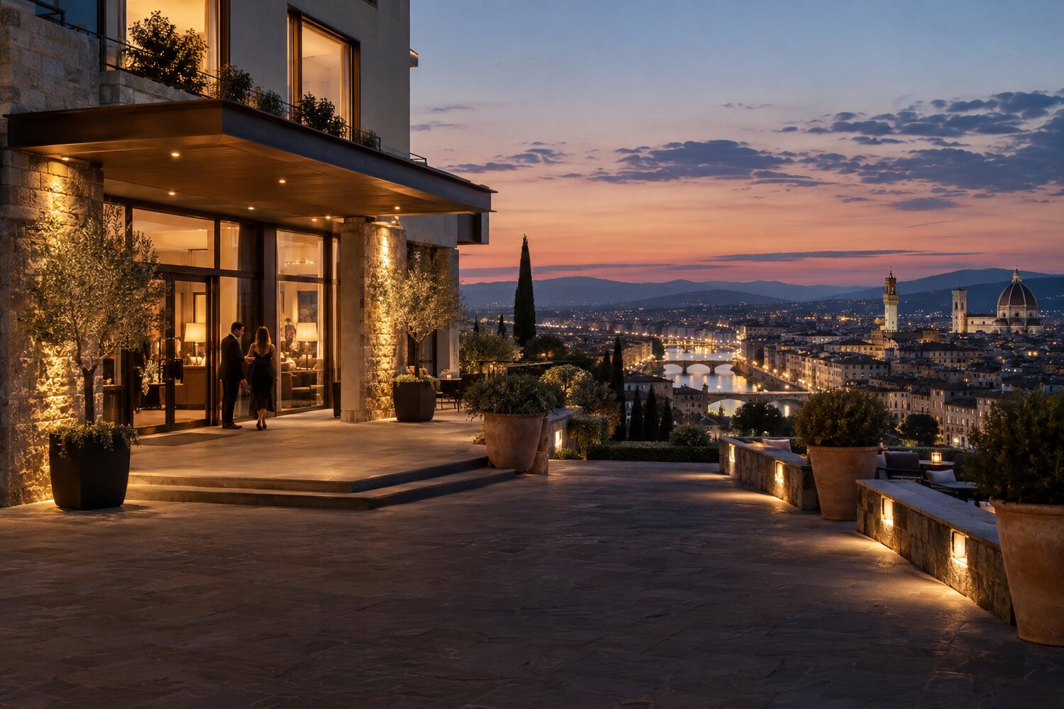 Hotel entrance overlooking a city at dusk